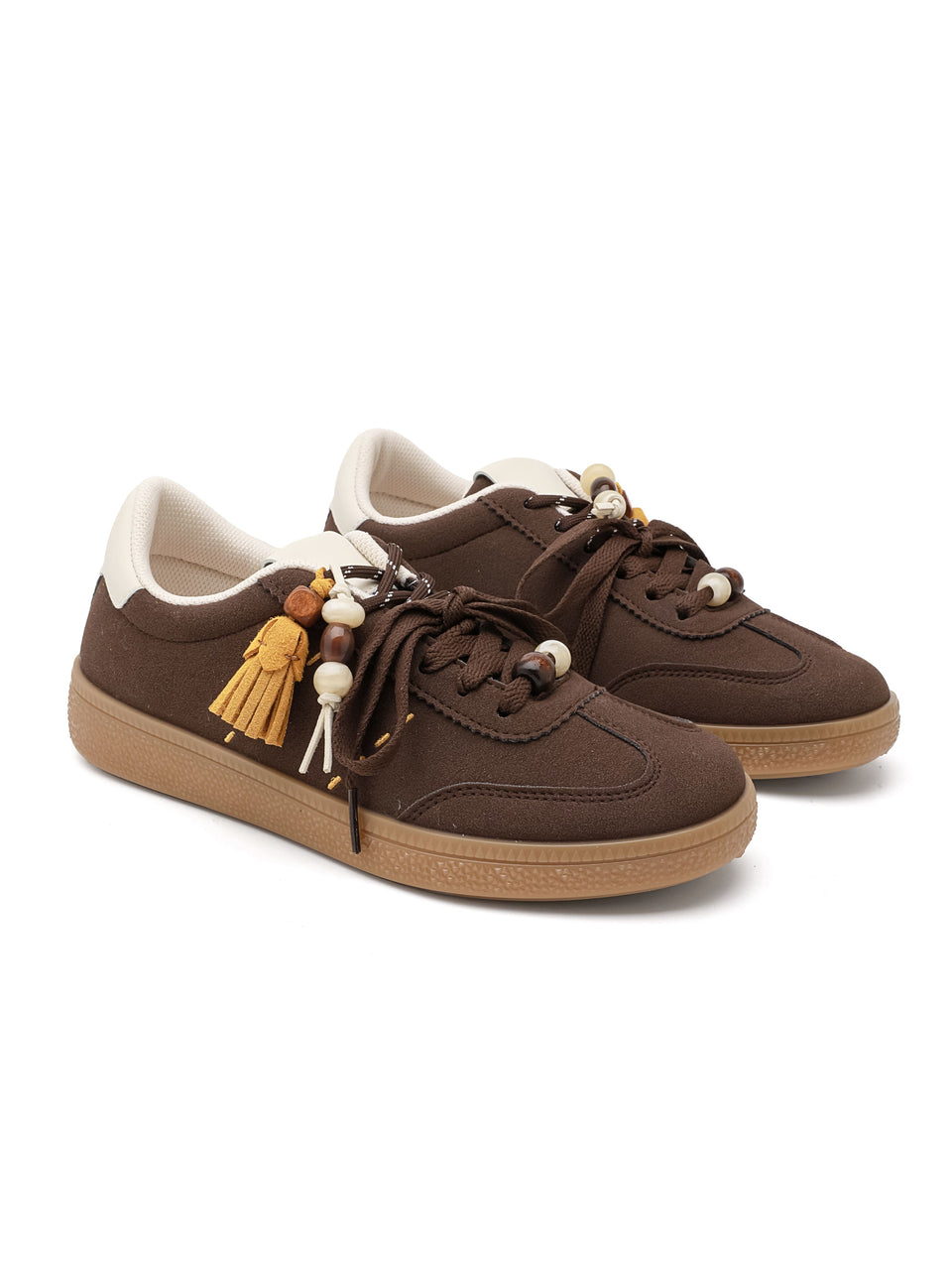 Sneaker ISABAC in ecopelle con suola beige, decorate con nappine e perline sui lacci.

Dettagli prodotto
• Made in China
• Materiali: Vegano (Materiali sintetici)